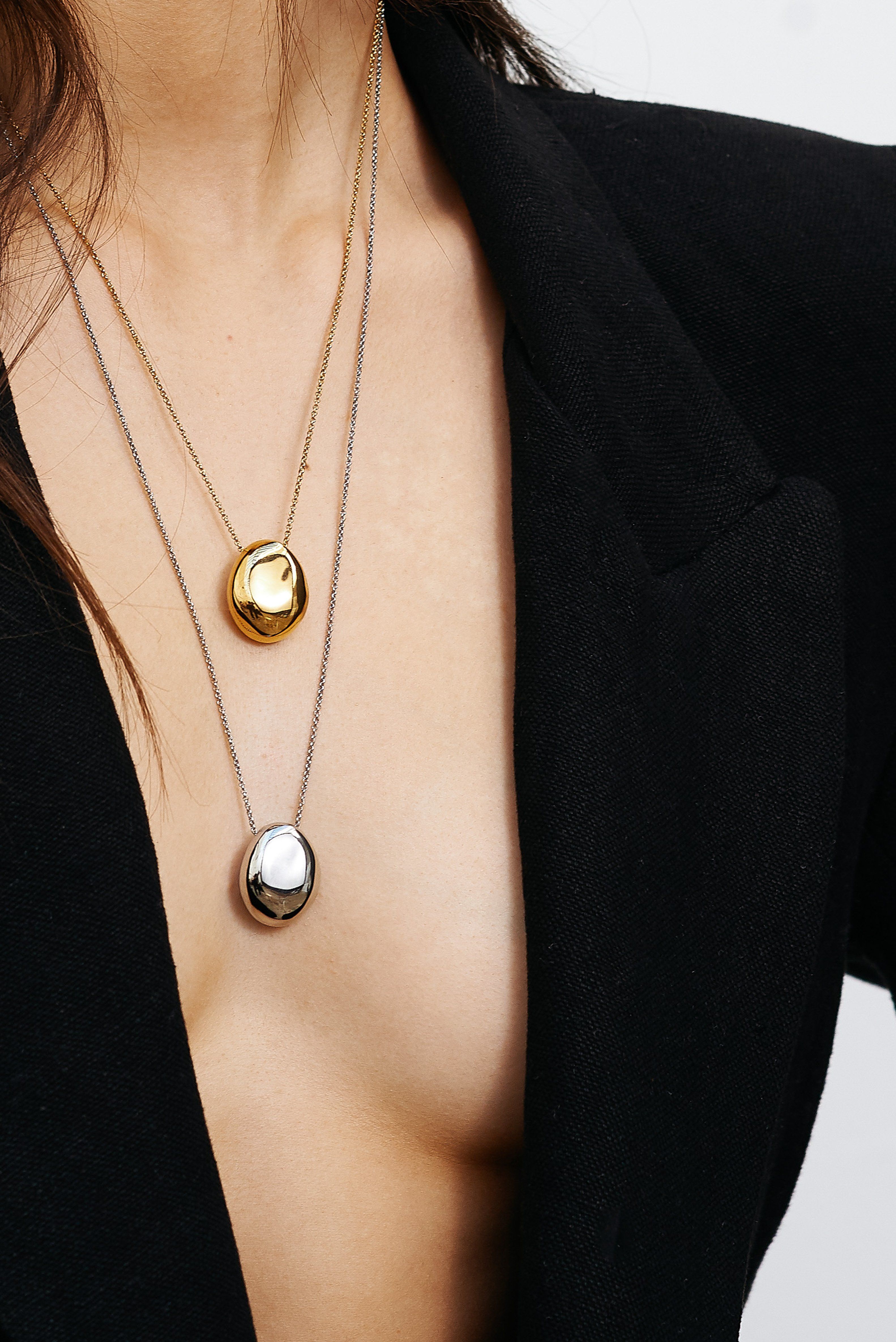 Detail cropped view on model of Silver Orb Necklace and Gold Orb  Necklace by bagatiba 