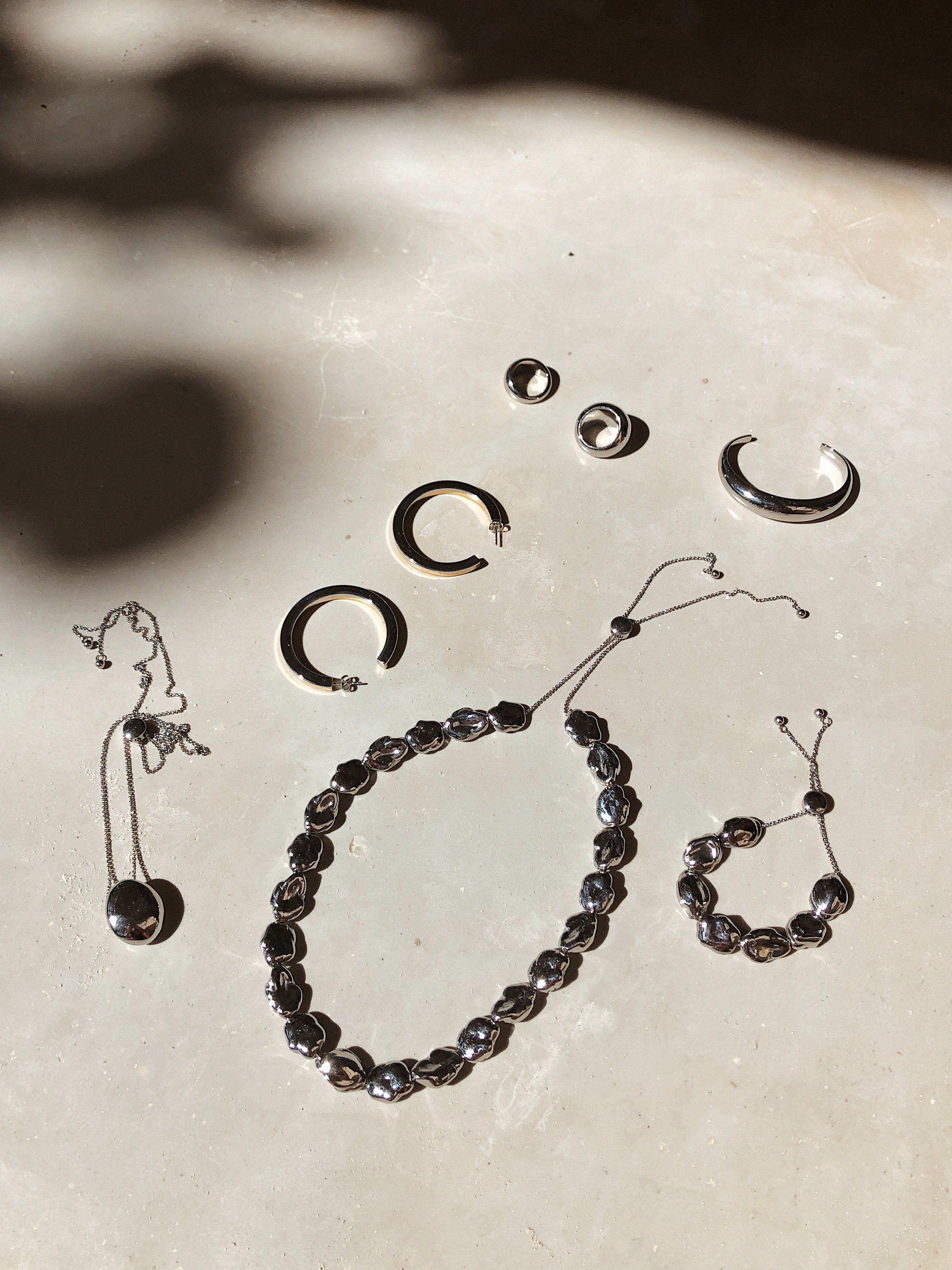 Silver Pearl Bracelet shown in natural light with other styles by bagatiba 