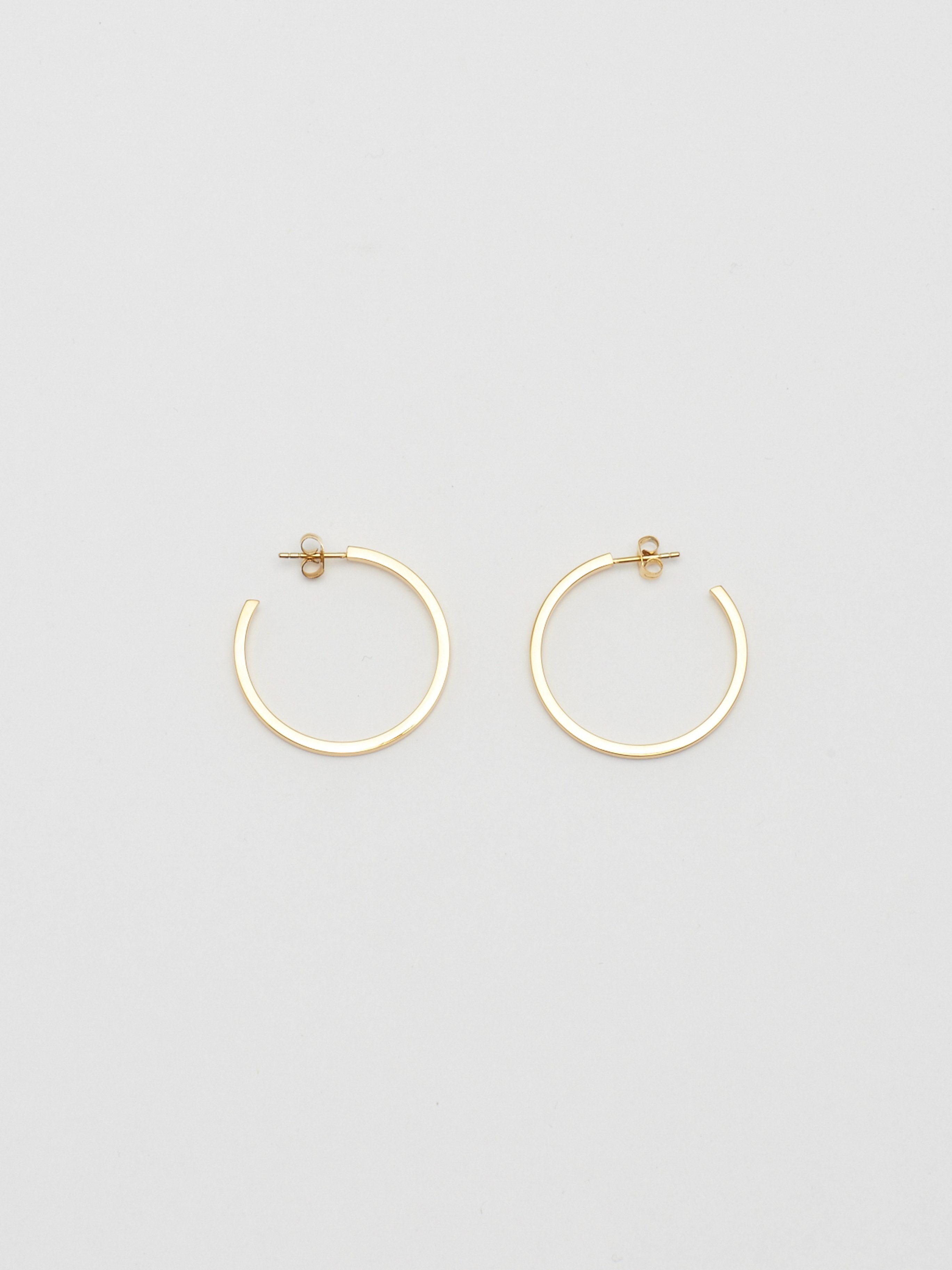 Full view flat lay of Simple Gold Hoops Earrings Bagatiba 