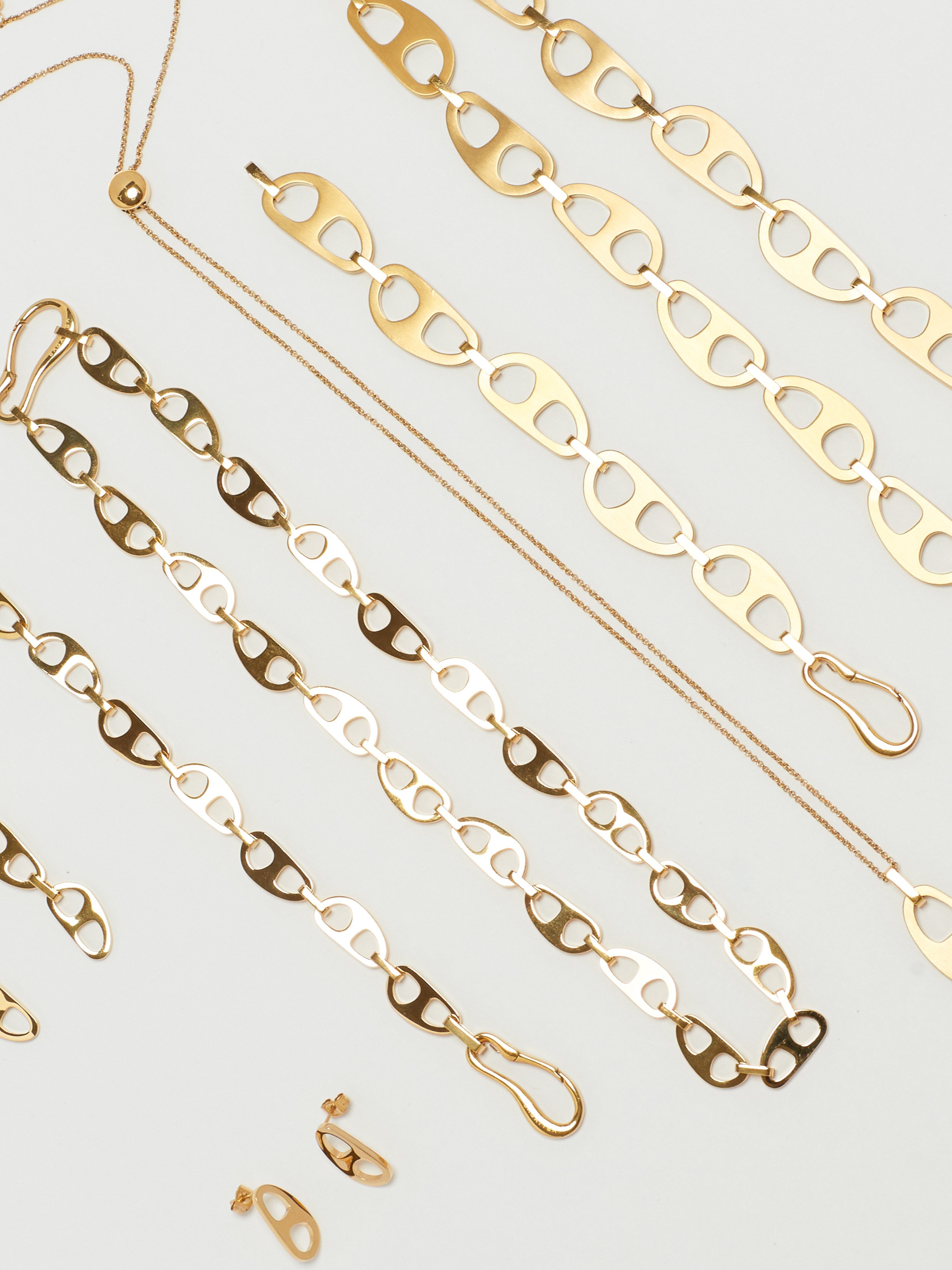 Detail view flat lay of the Gold Tab Collection by bagatiba 