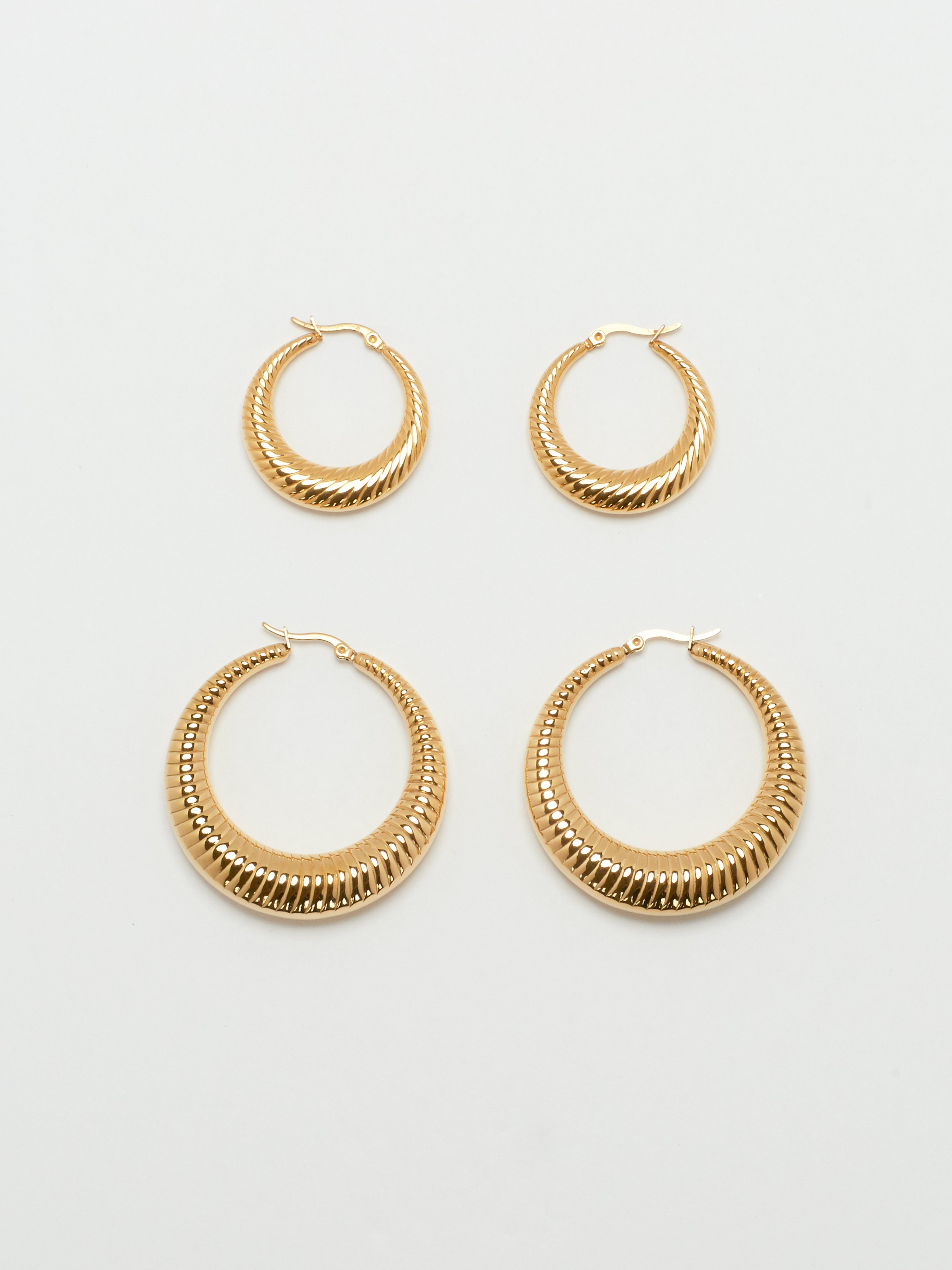 Detail flat lay of Small Spiral and Spiral Hoops Earrings bagatiba 