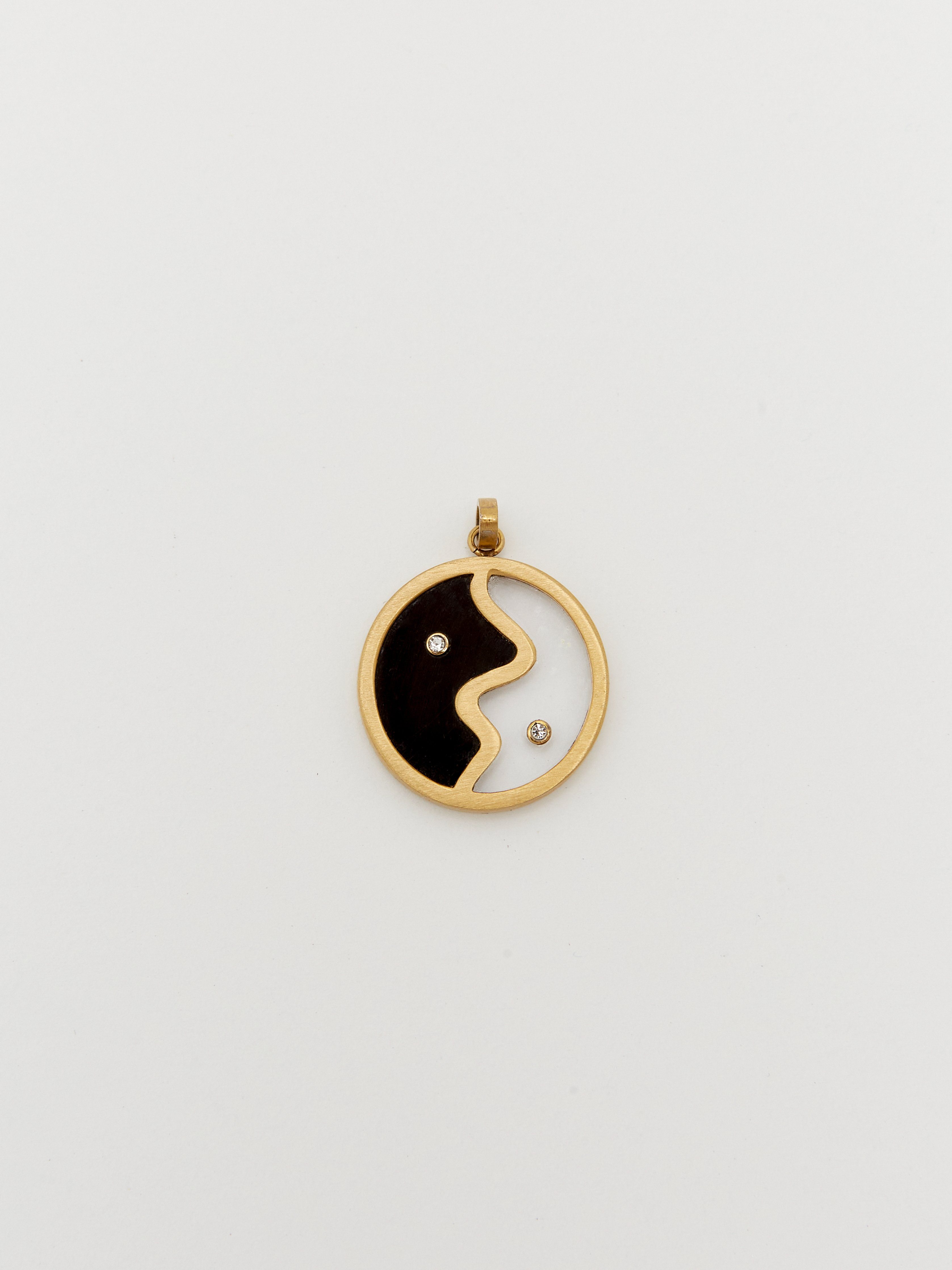 Detailed flat lay of the Yin Yang Glass Necklace Necklace bagatiba 