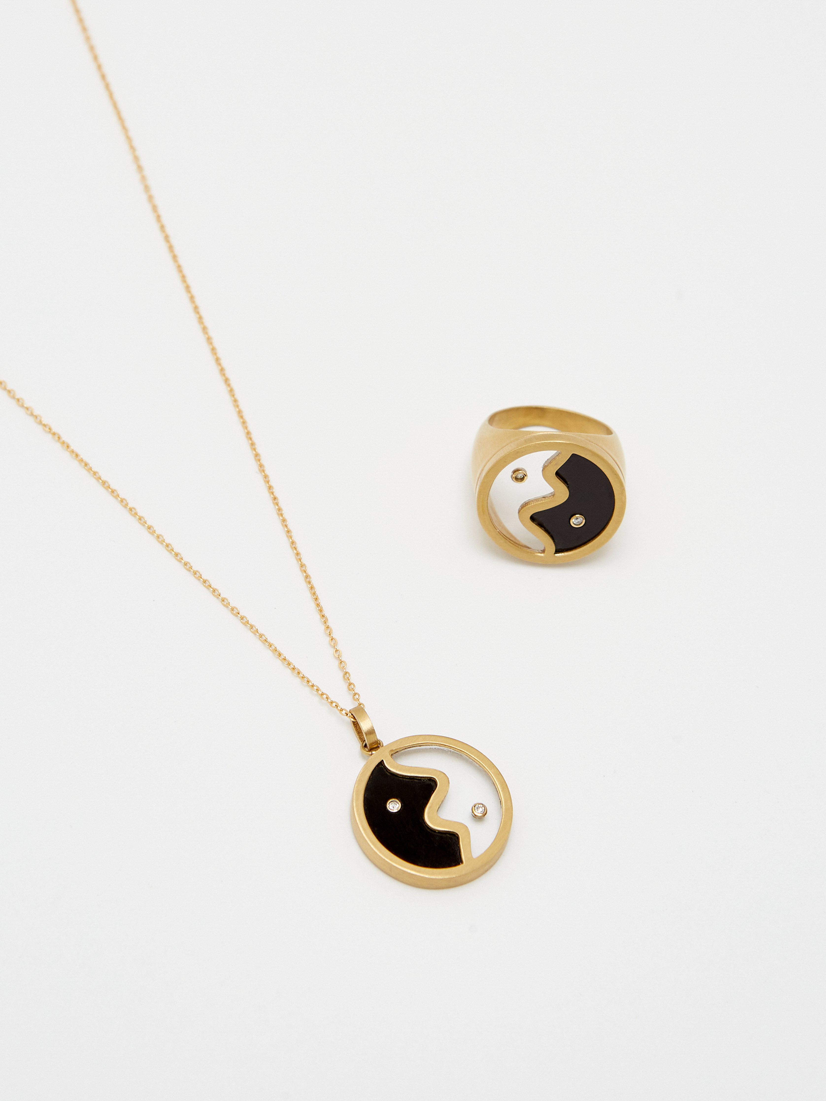 Detail flat lay view of the Yin Yang Glass Ring & Necklace bagatiba 